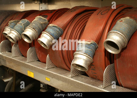 70mm fire fighting hose in fire engine locker ready to use, fire fighting equipment Stock Photo