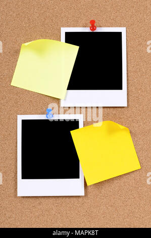Blank photo prints with sticky notes pinned to a cork bulletin board. Stock Photo