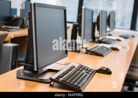 Empty computer room neatly placed for student in a computer lab. Stock Photo