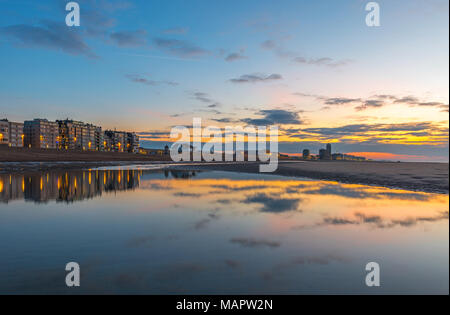 Sunset along North Sea beach of Oostende, Belgium. Stock Photo