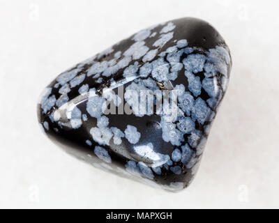 Macro Shooting Of Natural Mineral Rock Specimen Pebble Of Snowflake Obsidian Gem Stone On White Marble Background From Usa Stock Photo Alamy