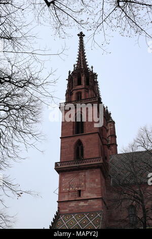 Bell tower of the Basler Münster / Minster, branches in the foreground, red sandstone, historical architecture, Basel, Switzerland, Europe Stock Photo