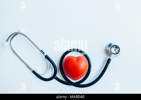 close up red heart and stethoscope on white background, world health day concept, process vintage tone Stock Photo