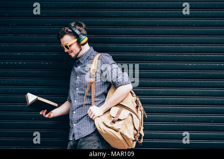 Closeup on a man holding a bible at shopping mall, believe concept Stock Photo