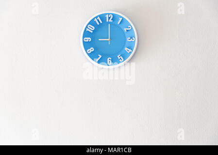 Good morning or night time with 9:00 clock on white concrete wall interior background with copy space, message board concept. Good morning is the gree Stock Photo