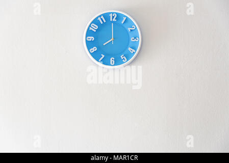 Good morning or night time with 8:00 clock on white concrete wall interior background with copy space, message board concept. Good morning is the gree Stock Photo