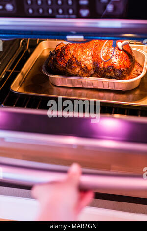 Cooking lamb roast in residential oven Stock Photo - Alamy