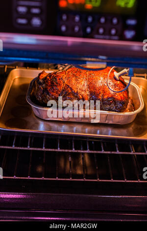 Cooking lamb roast in residential oven Stock Photo - Alamy