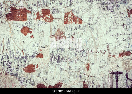 Tekstura old wall of white plaster with scratches. Processing in retro style or vintage for design and creativity.Cracked and decayed brick stucco wal Stock Photo