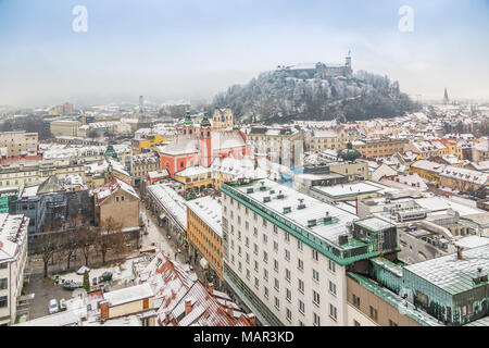 View of snow covered Ljubljana old town and Castle from The Skyscraper, Ljubljana, Slovenia, Europe Stock Photo