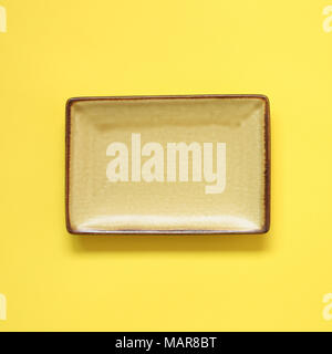 Yellow dish isolated on yellow background Stock Photo