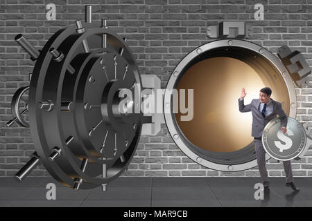 Businessman robbing bank in financial crime concept Stock Photo