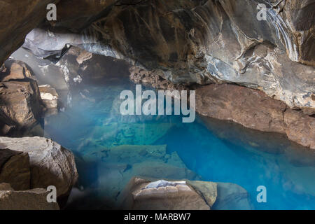 Small lava cave Grjotagja with a thermal spring inside. Myvatn, Iceland Stock Photo