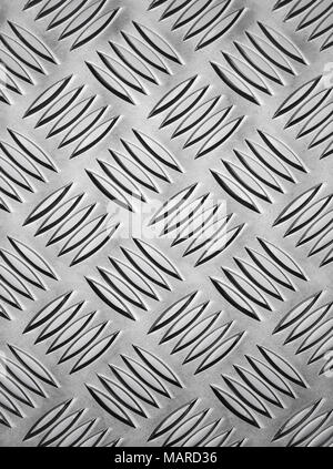 Abstract pattern made from Industrial non slip embossed metal. Stock Photo