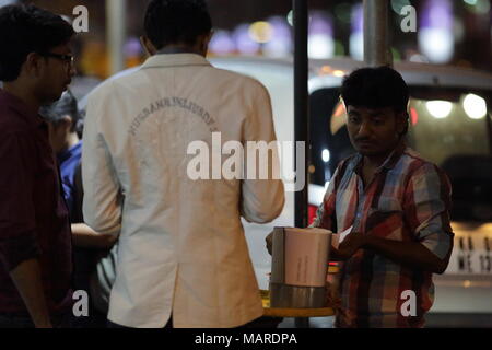 Bangalore, India - October 16, 2016: An unknown man offering street side chats to his customers this evening at MG Road, Bangalore. Stock Photo