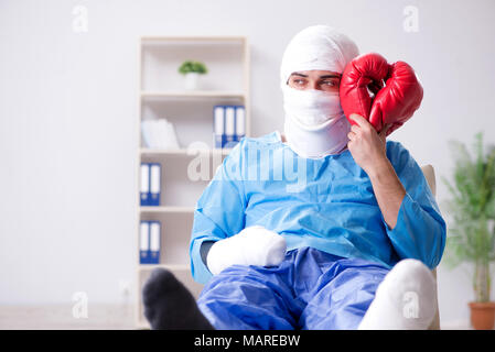 Injured boxer recovering in hospital Stock Photo