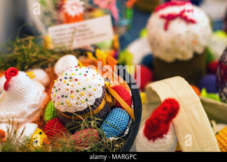 Knitted easter cake and eggs in the basket Stock Photo