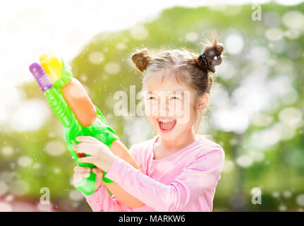 Adorable Little Girl Playing with Water Gun on Hot Summer Day. Cute Child  Having Fun with Water Outdoors Stock Photo - Image of leisure, beautiful:  97180460