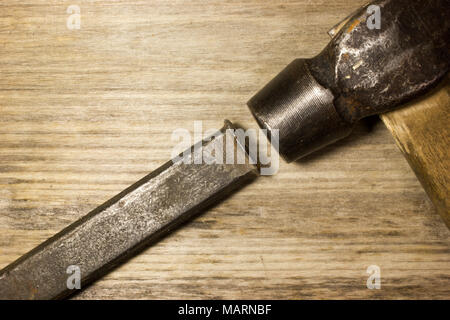 A hammer and chisel on wooden background Stock Photo