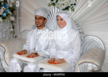 A traditional Malay wedding is one of the most diverse, not to mention lavish, cultural traditions in the world. Stock Photo