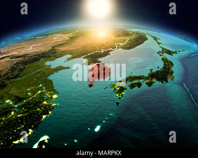 Sunrise above South Korea highlighted in red on model of planet Earth ...