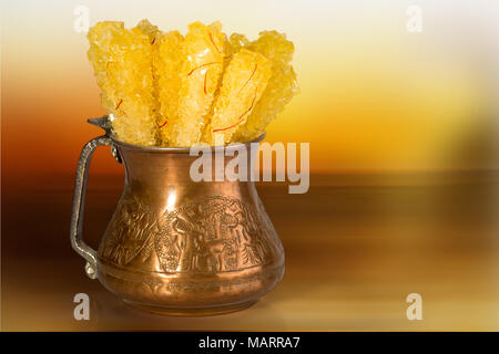 White nabat with black background , Iranian rock candy on a wooden ...