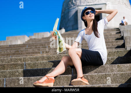 Asian female tourist smiling  outdoors Stock Photo