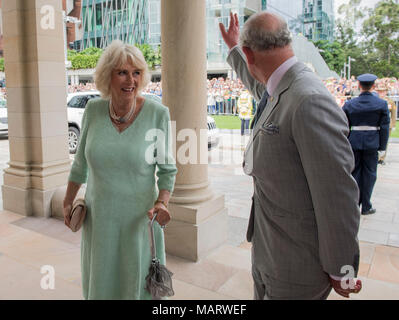 The Prince of Wales and the Duchess of Cornwall are greeted by crowds at Old Government House in Brisbane, Australia. Stock Photo