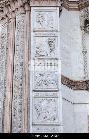 Story of Cain and Abel and Noah depicted in the marble relieves by Italian Renaissance sculptor Jacopo della Quercia (1425) on the Porta Magna (main door) of the Basilica of San Petronio (Basilica di San Petronio) in Piazza Maggiore in Bologna, Emilia-Romagna, Italy. Stock Photo