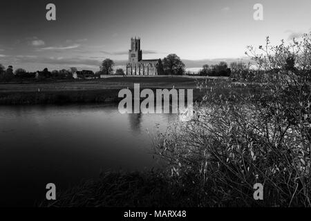 Autumn sunset, river Nene; St Marys church, Fotheringhay village, Northamptonshire; England Stock Photo