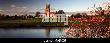 Autumn sunset, river Nene; St Marys church, Fotheringhay village, Northamptonshire; England Stock Photo