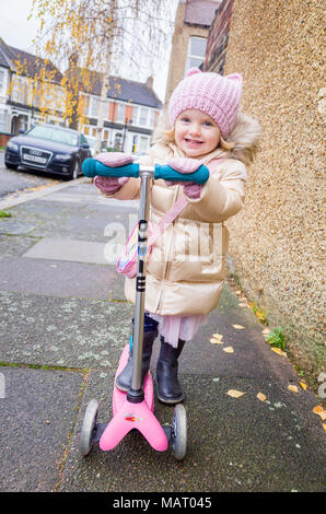 Two year old child on her Mini Micro Scooter, UK, London Stock Photo