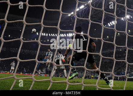 Turin, Italy. 3rd Apr, 2018. Real Madrid's Cristiano Ronaldo (L) scores during the UEFA Champions League quarterfinal first leg soccer match between Juventus and Real Madrid in Turin, Italy, on April 3, 2018. Real Madrid won 3-0. Credit: Alberto Lingria/Xinhua/Alamy Live News Stock Photo