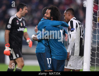 Turin, Italy. 3rd Apr, 2018. Real Madrid's Marcelo (R) celebrates after scoring during the UEFA Champions League quarterfinal first leg soccer match between Juventus and Real Madrid in Turin, Italy, on April 3, 2018. Real Madrid won 3-0. Credit: Alberto Lingria/Xinhua/Alamy Live News Stock Photo