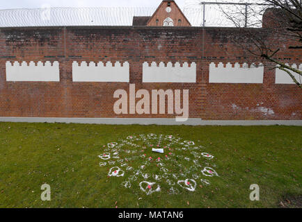 04 April 2018, Germany, Neumuenster: Hearts made of sand, stones and flowers and a portrait of Catalan Regional President Carles Puigdemont decorate the lawn outside the correctional facility. Photo: Carsten Rehder/dpa Stock Photo