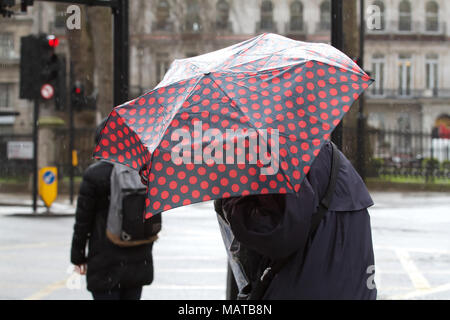 London, UK. 4th April 2018. UK Weather: Heavy Rainfall in Victoria London. As forecasters predict much warmer weather to arrive at the weekend©Keith Larby/Alamy Live News Stock Photo