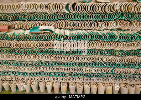 MOROCCO FES MEDINA SOUK ART NAJI FAMOUS BLUE HAND MADE POTTERY STACKED  GREEN AND CREAM  ROOF TILES Stock Photo