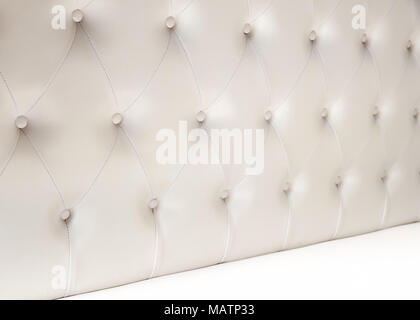 Luxury empty bedroom interior background, soft headboard and white bedding sheets on wide double bed Stock Photo