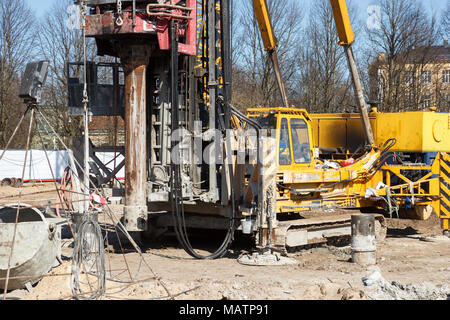pile bore machine. A pile driver is a mechanical device used to drive piles, poles into soil to provide foundation support for buildings Stock Photo