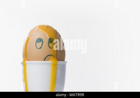 An unhappy, confused and dazed boiled egg.  Copy space on right. Stock Photo