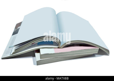 Opened blank pages of magazine or book, catalog on Stack of thick magazines isolated on a white background - a mock up for demonstrating your design Stock Photo