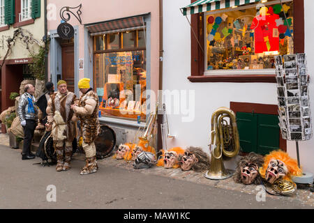 Basel carnival. Nadelberg, Basel, Switzerland - February 21st, 2018. Carnival revelers having a break in the old town Stock Photo