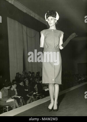 Model from the sixties walking on the catwalk, Italy Stock Photo