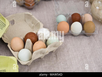 Ecological eggs in various colors and sizes in a carton fro a farmers market in Grunerlokka Oslo Norway Stock Photo