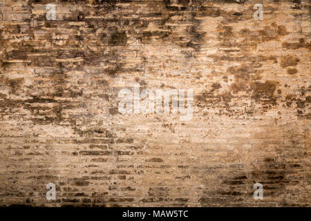 Weathered plaster and brick wall textured background Stock Photo