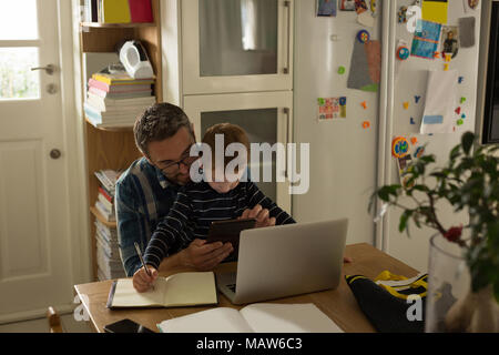 Father with his son using digital tablet Stock Photo