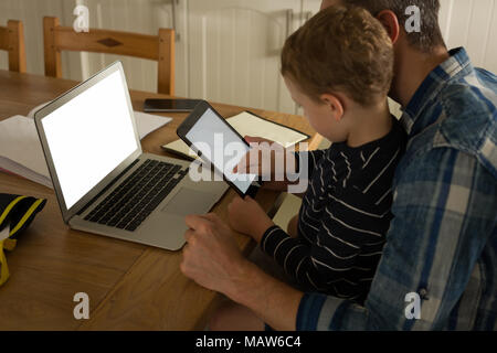 Father with his son using digital tablet Stock Photo