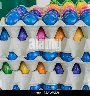Cardboard box with colored easter eggs Stock Photo