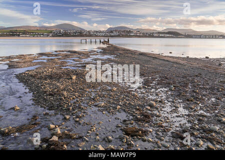 Old jetty on the Menai Straits at low tide, Anglesey, North Wales Stock Photo