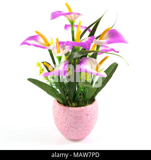 Decoration artificial flower or fake flower in the pot isolated in white background. Stock Photo